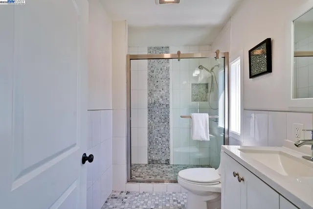 a bathroom with a shower and toilet