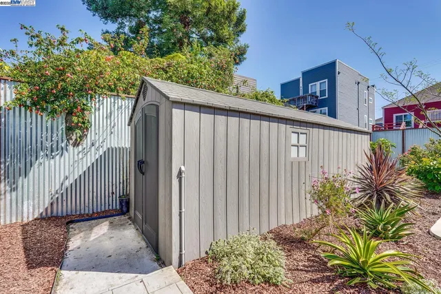 a view of a patio with couches table and chairs and potted plants