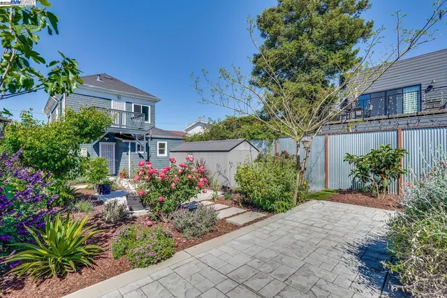 a view of a chair and table in the garden