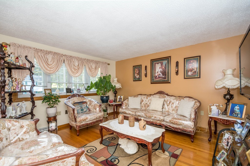 52 Westwind Road Lowell, MA 01852 - Photo 2 of 28 a living room with furniture a rug and a window
