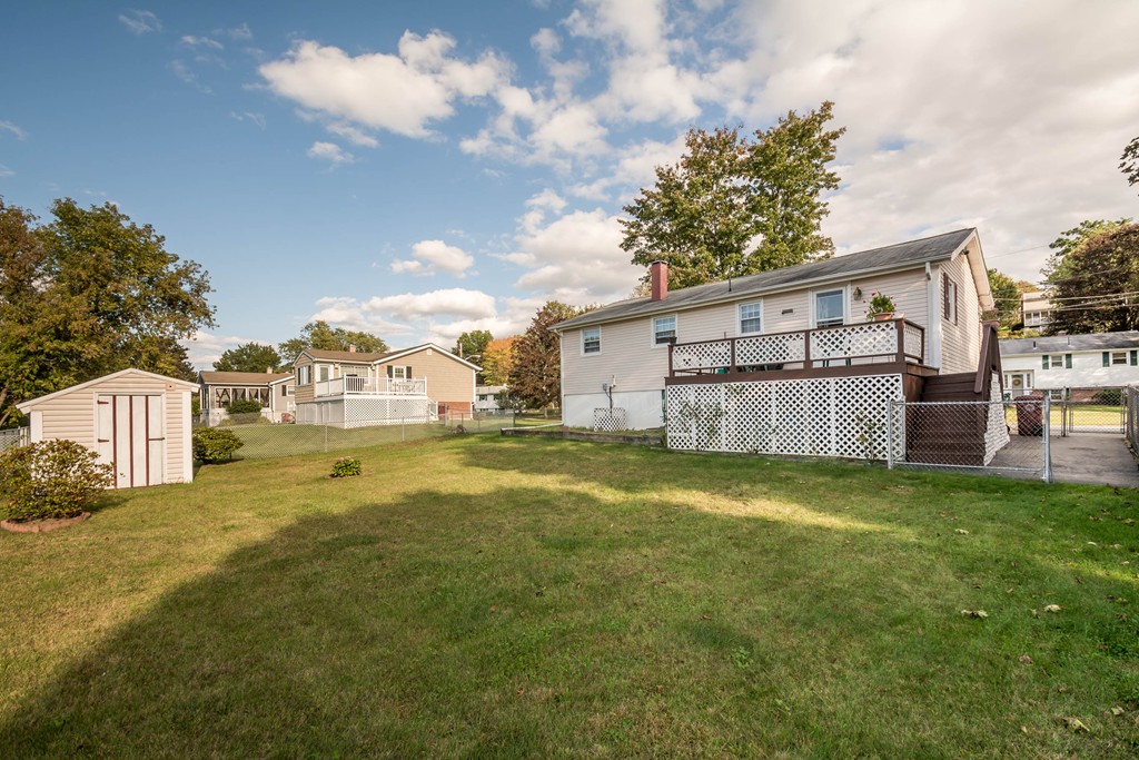52 Westwind Road Lowell, MA 01852 - Photo 28 of 28 a view of a house with a yard