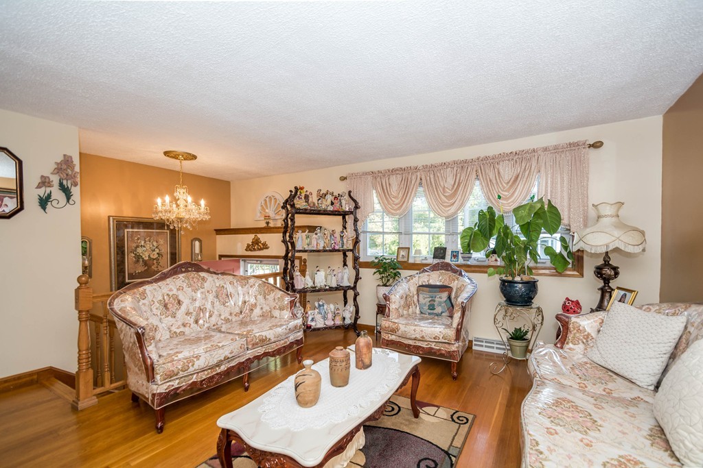 52 Westwind Road Lowell, MA 01852 - Photo 3 of 28 a living room with furniture and a large window
