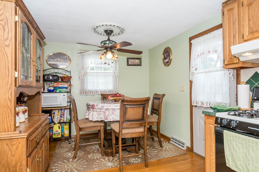 52 Westwind Road Lowell, MA 01852 - Photo 8 of 28 a dining room with furniture and window