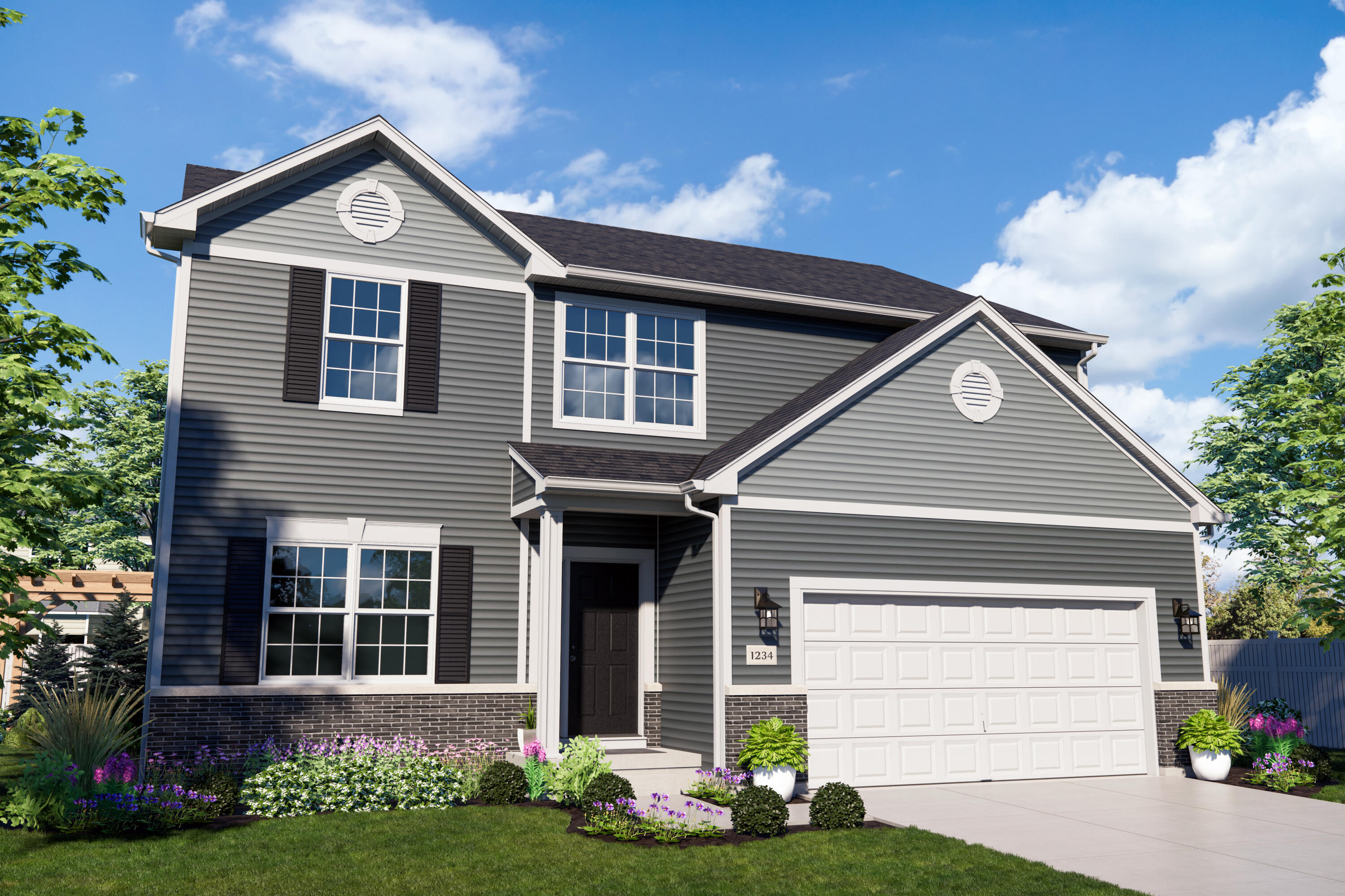 a front view of a house with a garden and plants