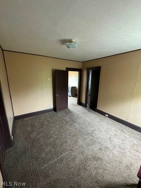 1187 Addison Road Cleveland, OH 44103 - Photo 15 of 25 Spare room with carpet floors and a textured ceiling