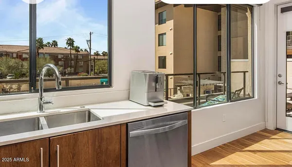 a kitchen with a sink and a window