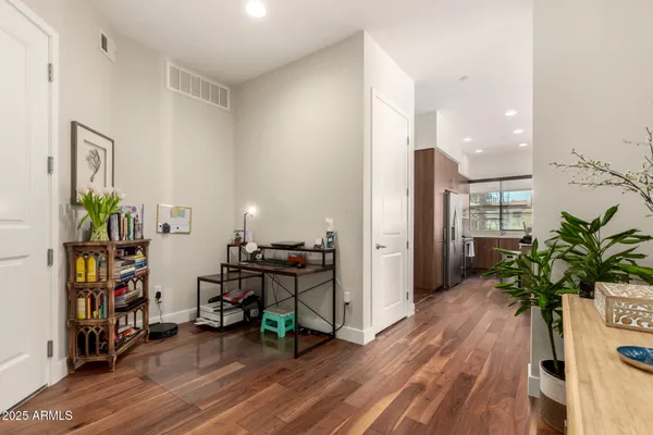 a living room with furniture and a potted plant