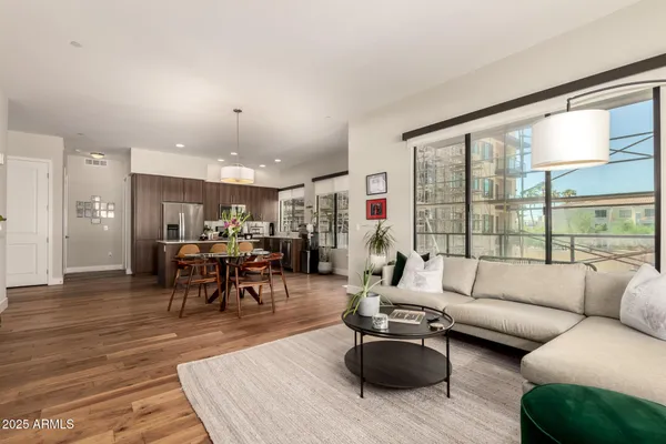 a living room with furniture and a large window
