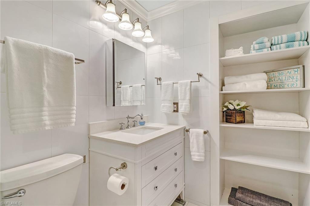 401 Bayfront Place, Unit 3208 Naples, FL 34102 - Photo 13 of 22 a bathroom with a sink a toilet and shower