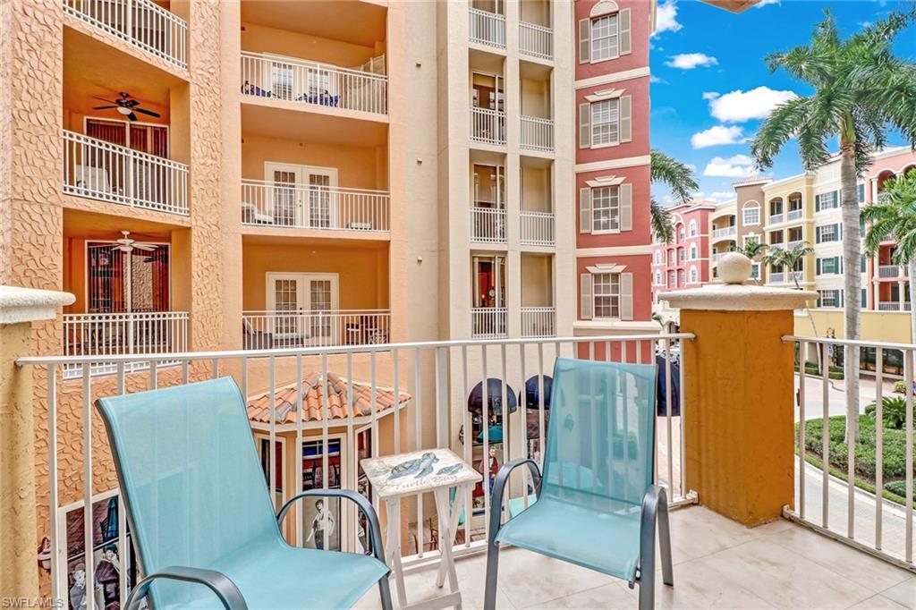 401 Bayfront Place, Unit 3208 Naples, FL 34102 - Photo 15 of 22 a view of a balcony with table and chairs