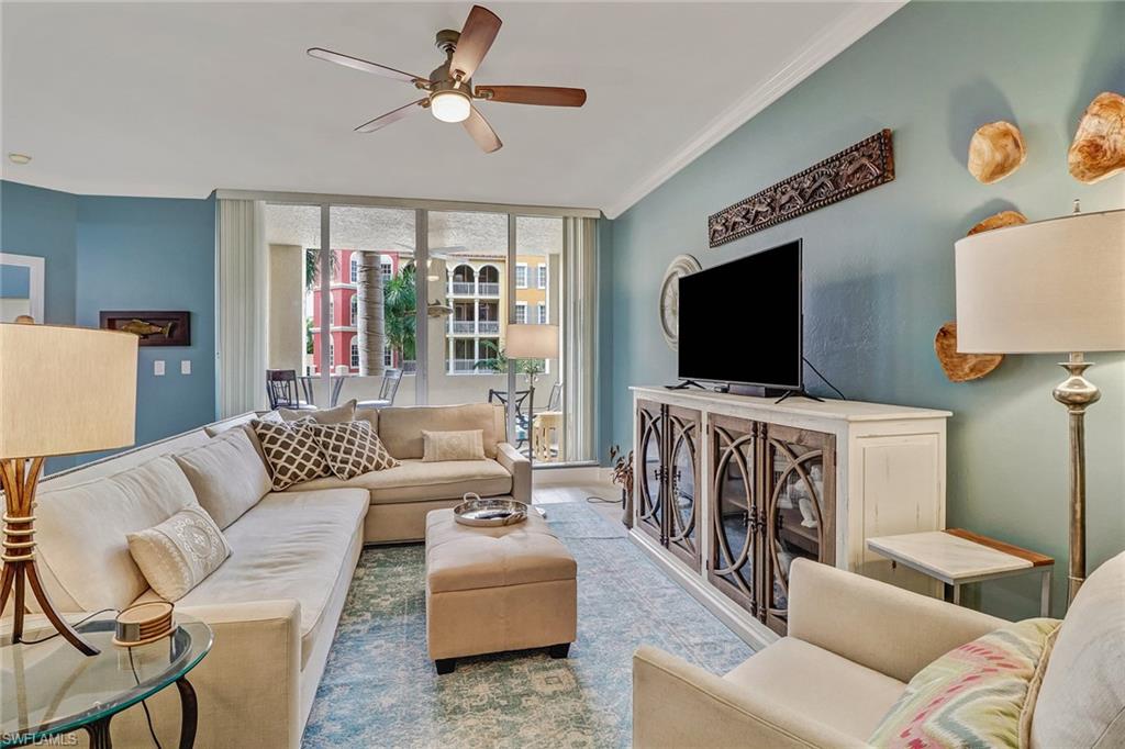 401 Bayfront Place, Unit 3208 Naples, FL 34102 - Photo 2 of 22 a living room with furniture and a flat screen tv