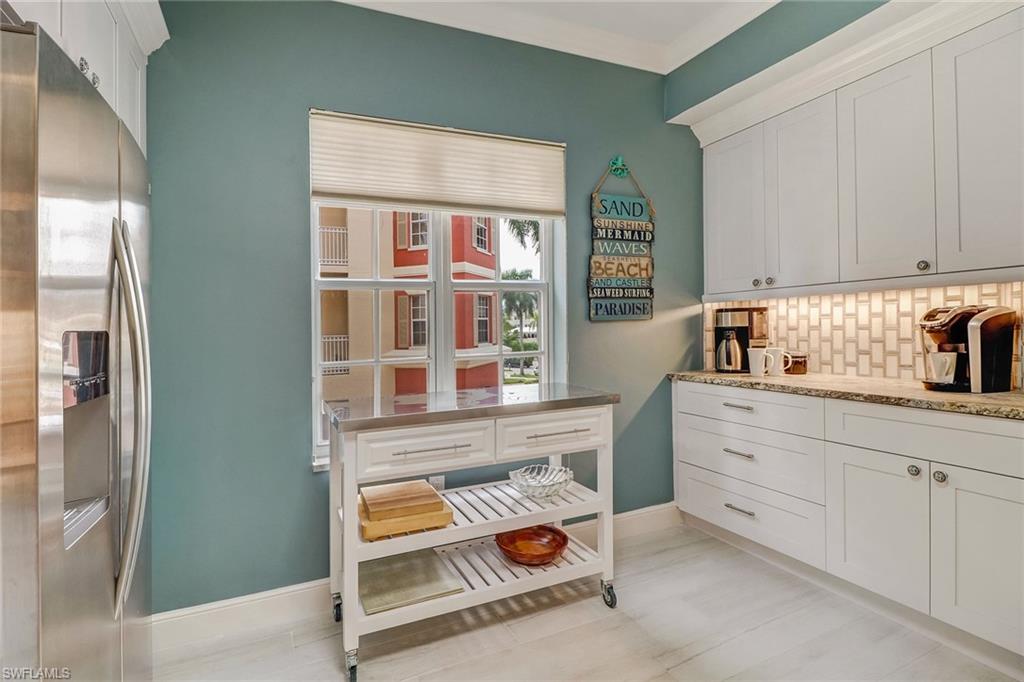 401 Bayfront Place, Unit 3208 Naples, FL 34102 - Photo 6 of 22 a kitchen with cabinets and window