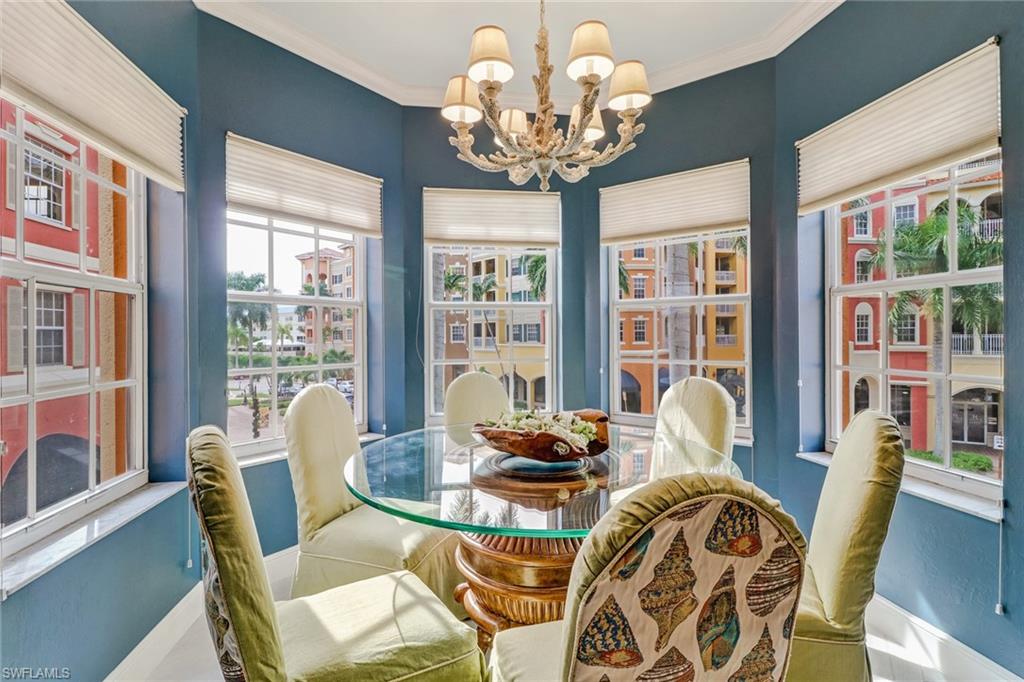 401 Bayfront Place, Unit 3208 Naples, FL 34102 - Photo 7 of 22 a dining room with furniture a large window and wooden floor