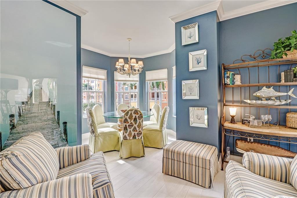 401 Bayfront Place, Unit 3208 Naples, FL 34102 - Photo 8 of 22 a living room with furniture and a floor to ceiling window