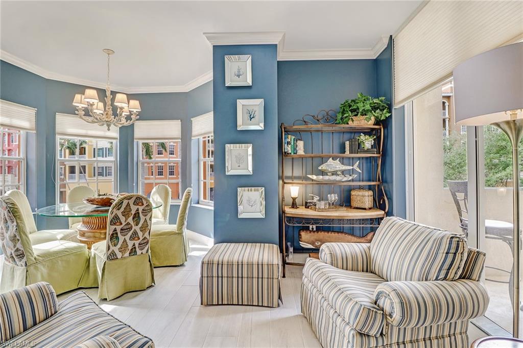 401 Bayfront Place, Unit 3208 Naples, FL 34102 - Photo 9 of 22 a living room with furniture and a floor to ceiling window