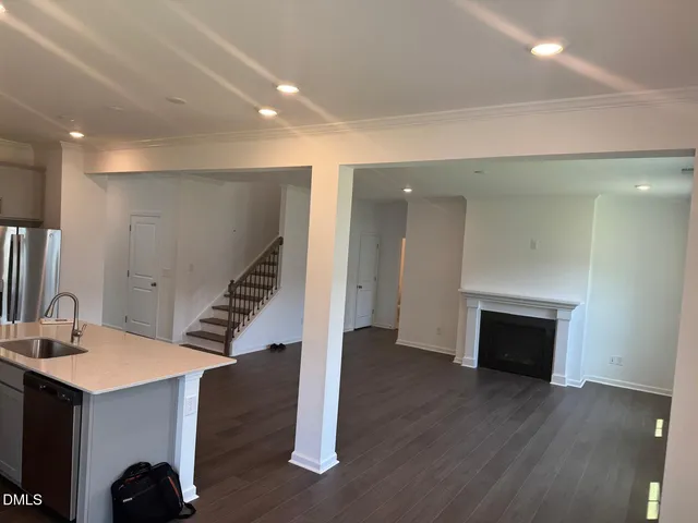 a room with stairs and wooden floor