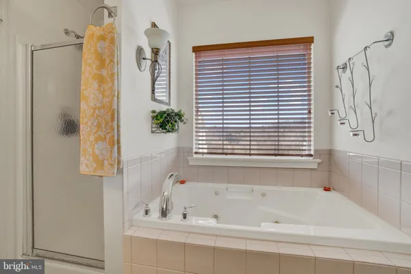 a bathroom with a toilet sink and a mirror