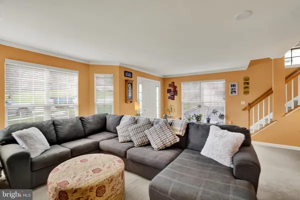 a kitchen with stainless steel appliances a sink a window and cabinets