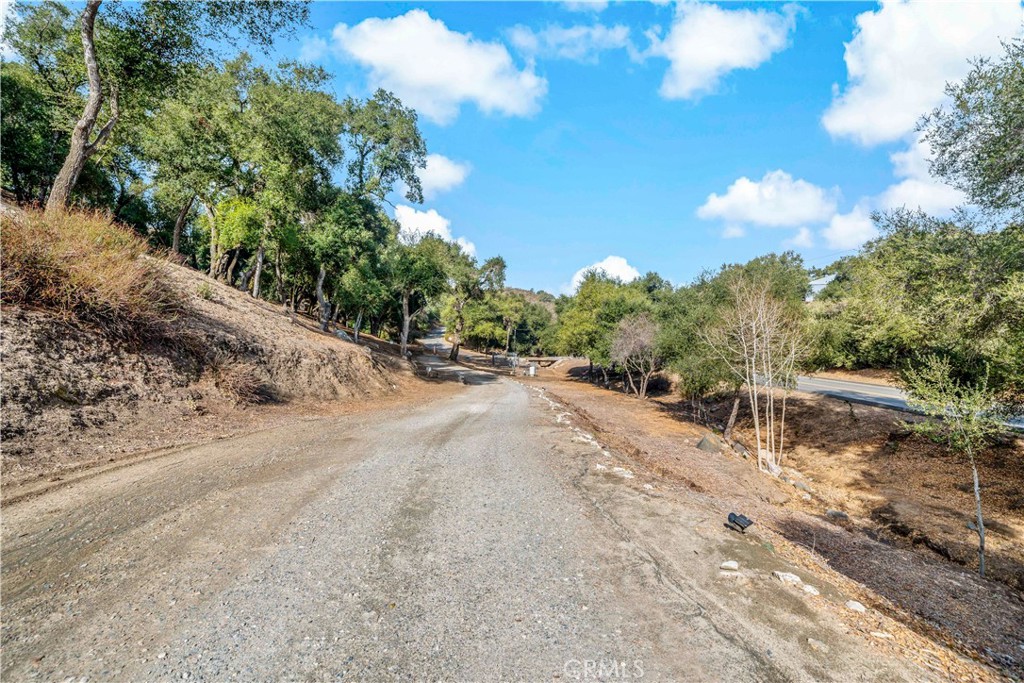 47333 Pala Road Temecula, CA 92592 - Photo 13 of 29 a view of a road with a yard