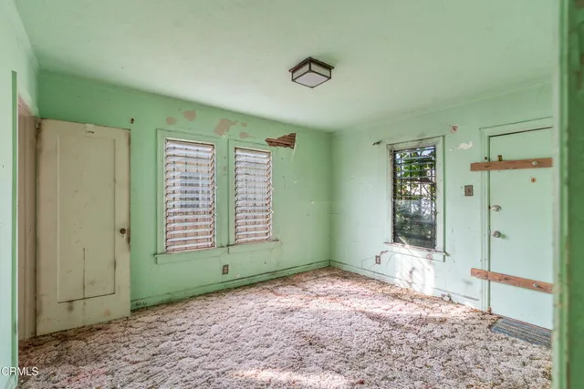 a view of an empty room with a window