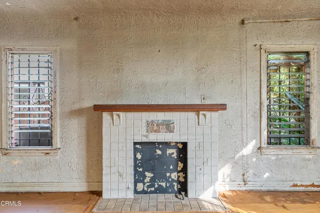 a view of a fireplace with wooden floor