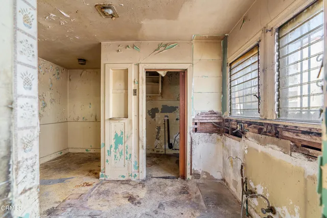 wooden floor and a bathroom with a sink