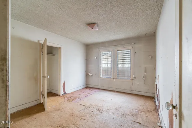 an empty room with windows