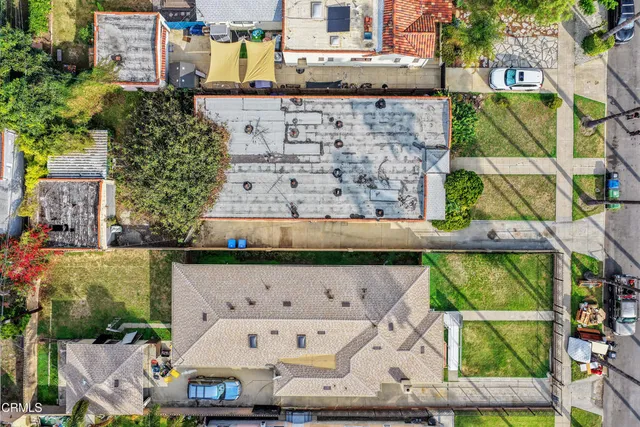 a buildings with green field in front of it