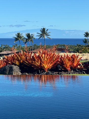 a view of swimming pool with a table and chairs in patio