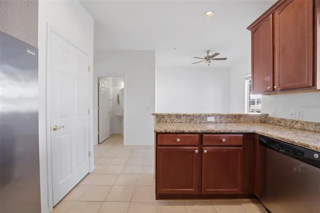 a view of a kitchen with granite countertop cabinets