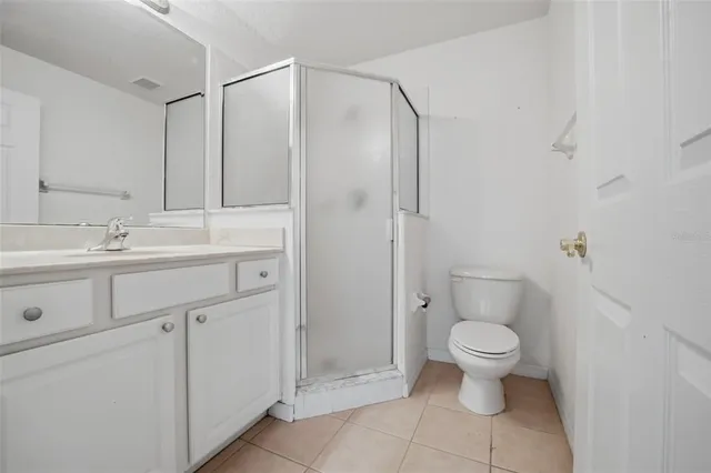 a view of bathroom with a sink toilet and shower