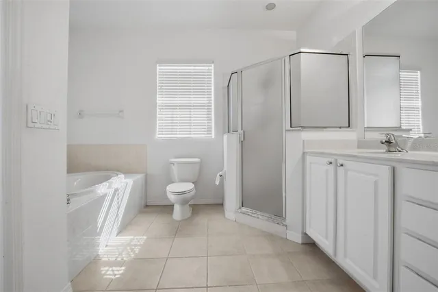 a bathroom with a toilet sink and a mirror