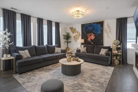 a living room with furniture and a large window