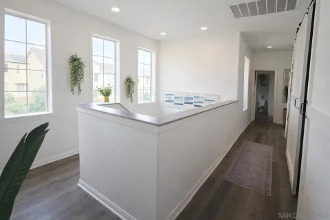 a view of kitchen with wooden floor and window