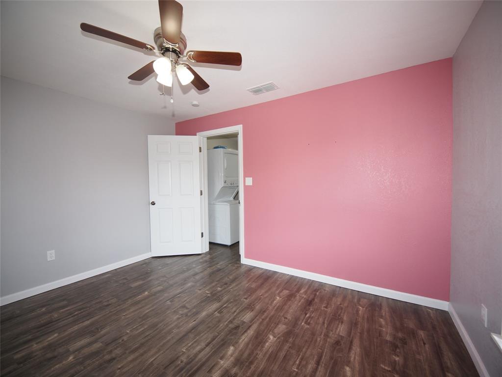 1327 Old Jacksboro Road Graham, TX 76450 - Photo 13 of 33 wooden floor in an empty room