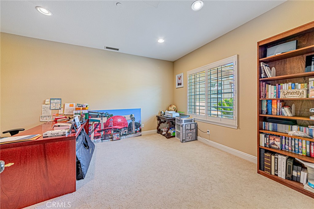 4088 Shady Ridge Circle Corona, CA 92881 - Photo 20 of 47 a view of a livingroom with workspace and a window
