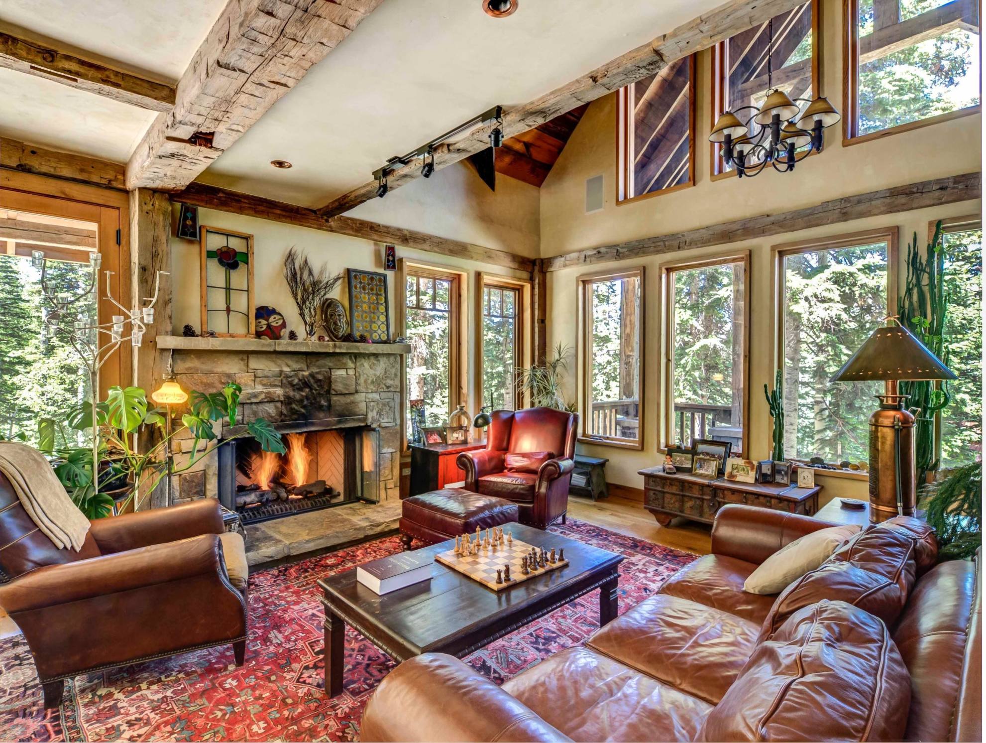 44 Spruce Way Telluride, CO 81435 - Photo 13 of 17 a living room with furniture fireplace and a large window
