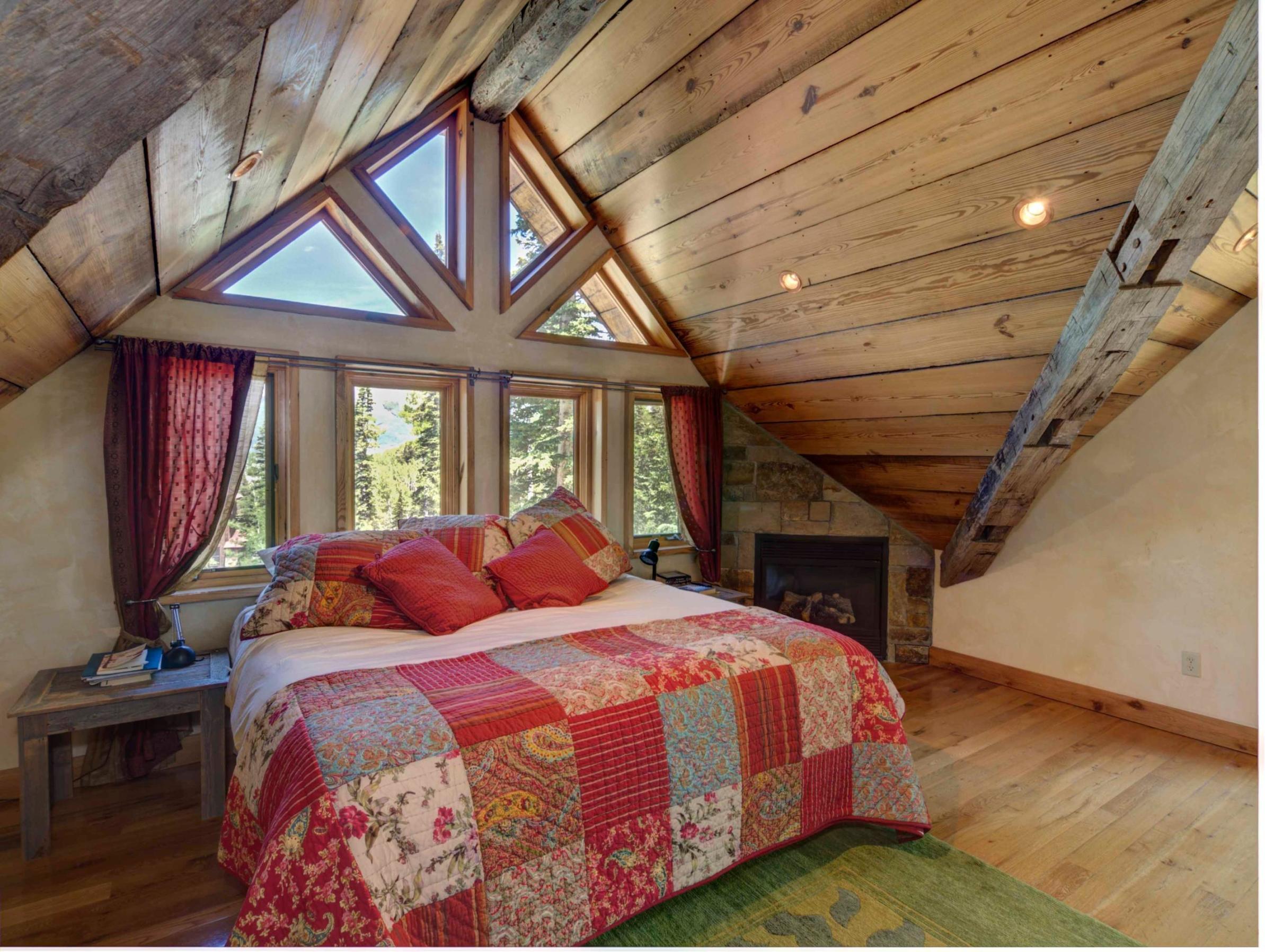 44 Spruce Way Telluride, CO 81435 - Photo 15 of 17 a bedroom with a bed and wooden floor