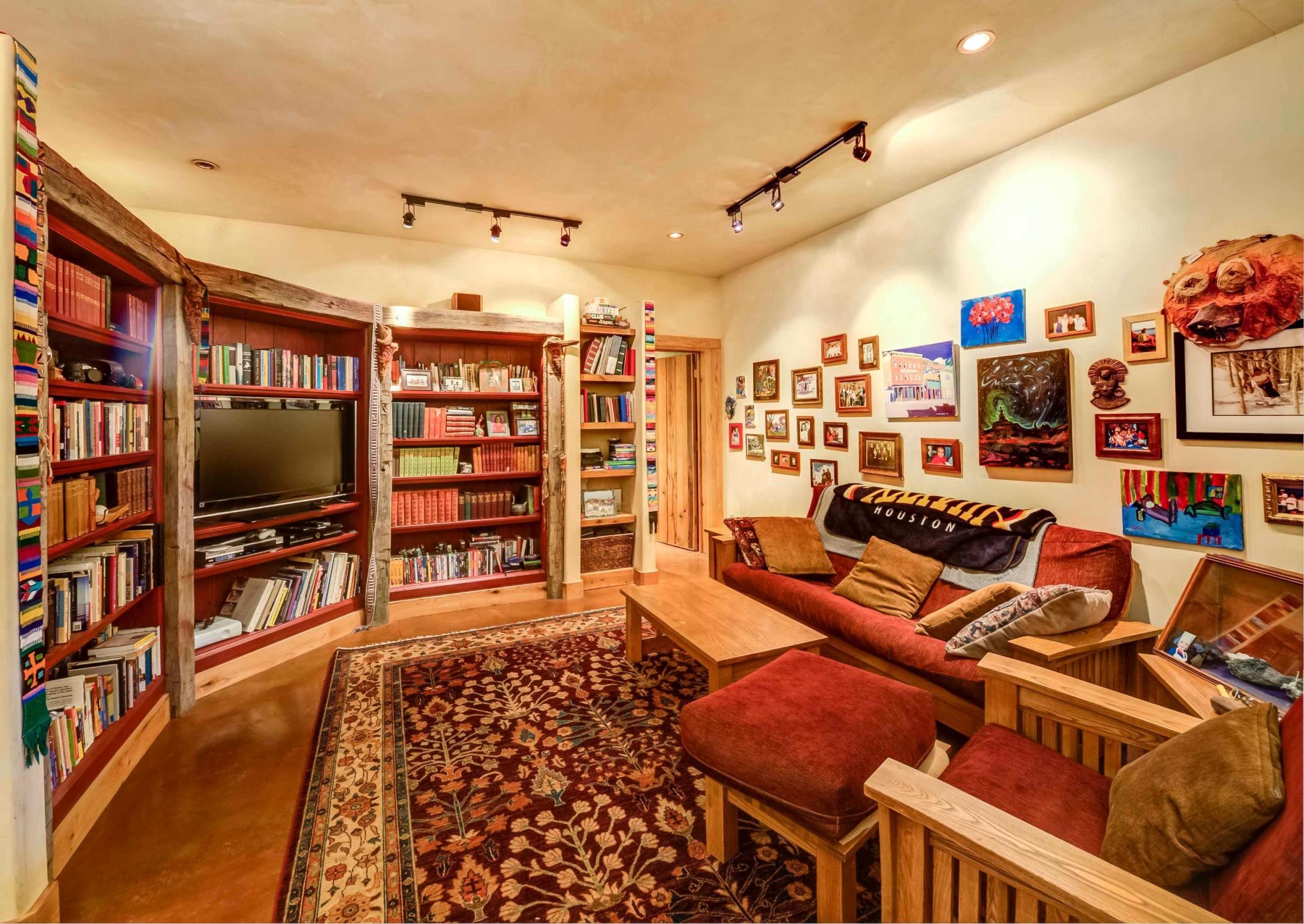 44 Spruce Way Telluride, CO 81435 - Photo 6 of 17 a living room with lots of furniture and a flat screen tv