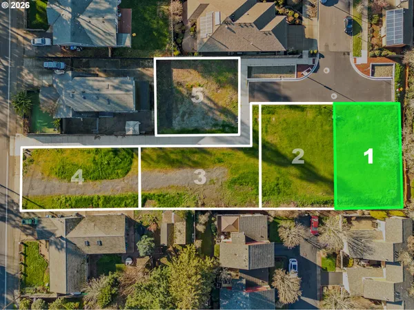 an aerial view of a house with a garden and swimming pool
