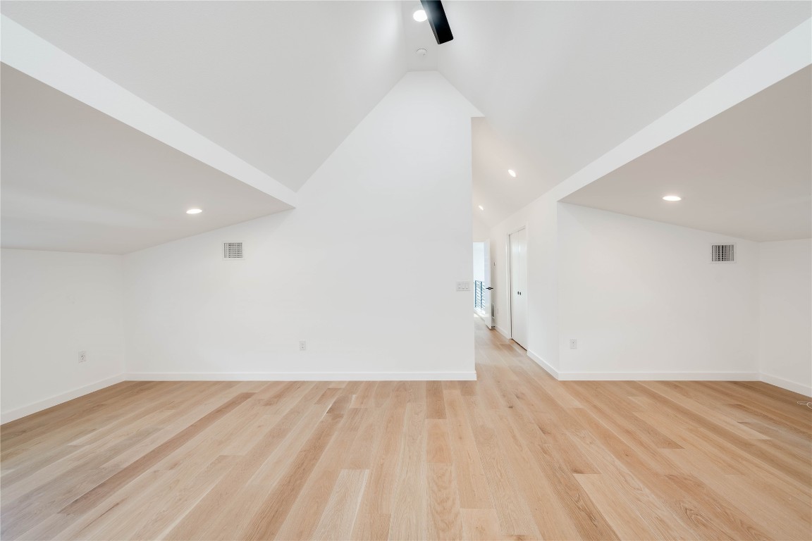 1208 Luna Street, Unit 1 Austin, TX 78721 - Photo 25 of 37 an empty room with wooden floor and windows