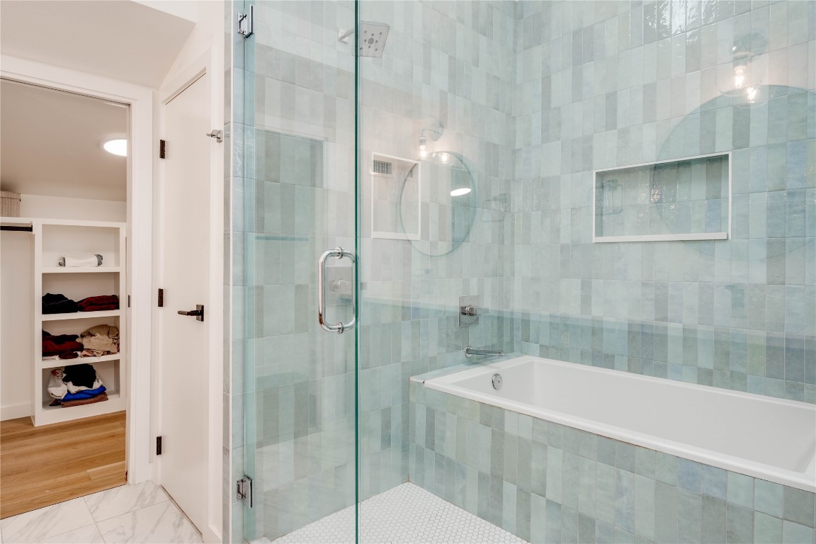 1208 Luna Street, Unit 1 Austin, TX 78721 - Photo 28 of 37 a bathroom with a bathtub and shower
