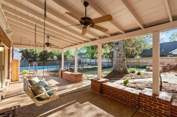 a view of a swimming pool with sitting area