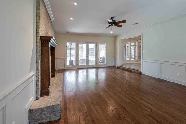 a view of a large window with wooden floor
