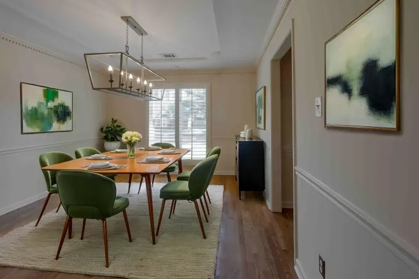 a kitchen with stainless steel appliances granite countertop a sink and a refrigerator