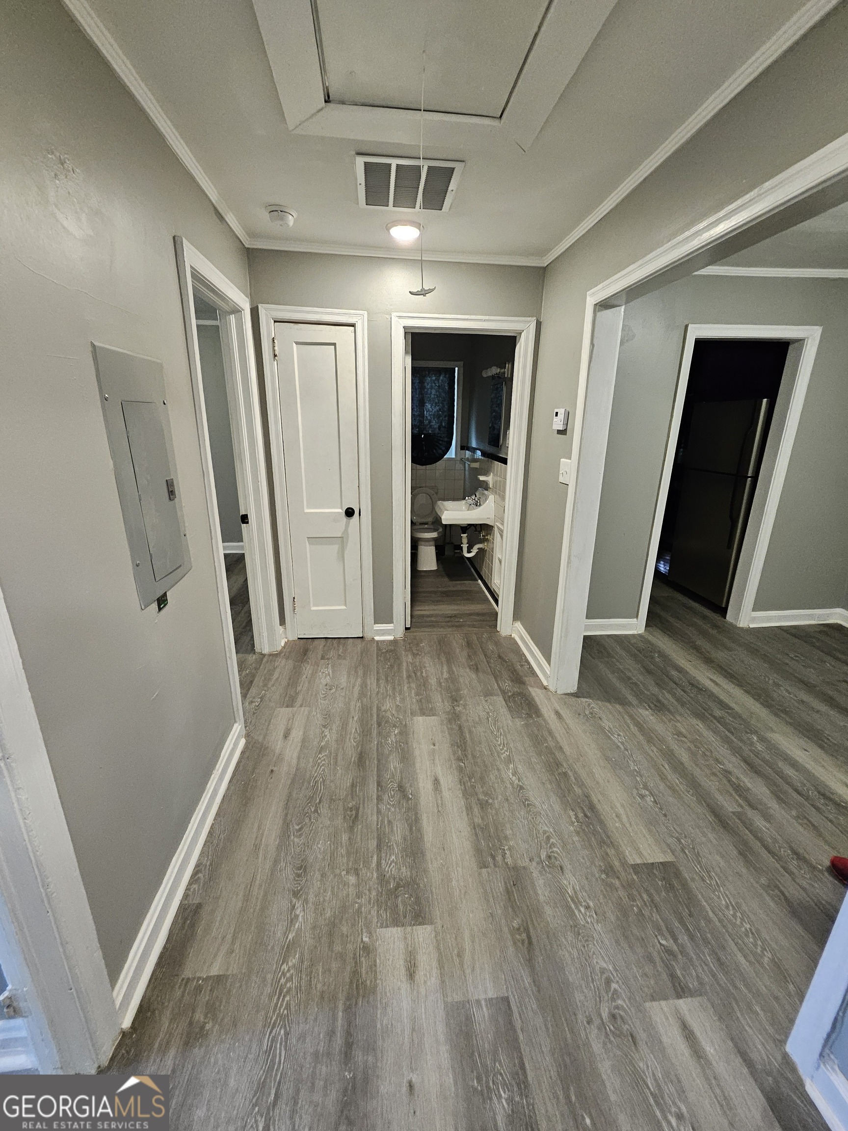 521 Meriwether Street, Unit A Griffin, GA 30224 - Photo 11 of 12 a view of livingroom with hardwood floor and hallway