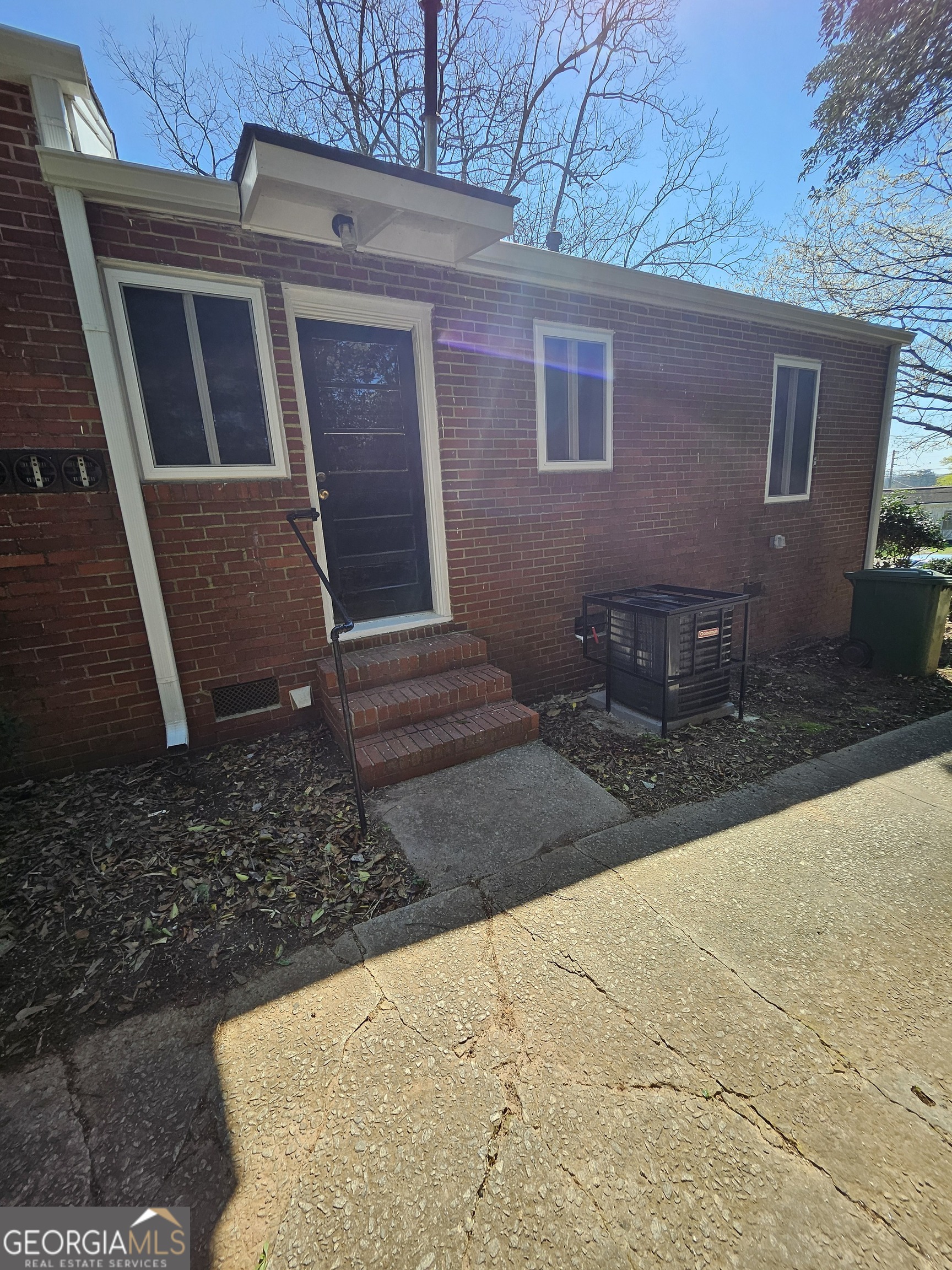 521 Meriwether Street, Unit A Griffin, GA 30224 - Photo 12 of 12 a view of a house with a yard