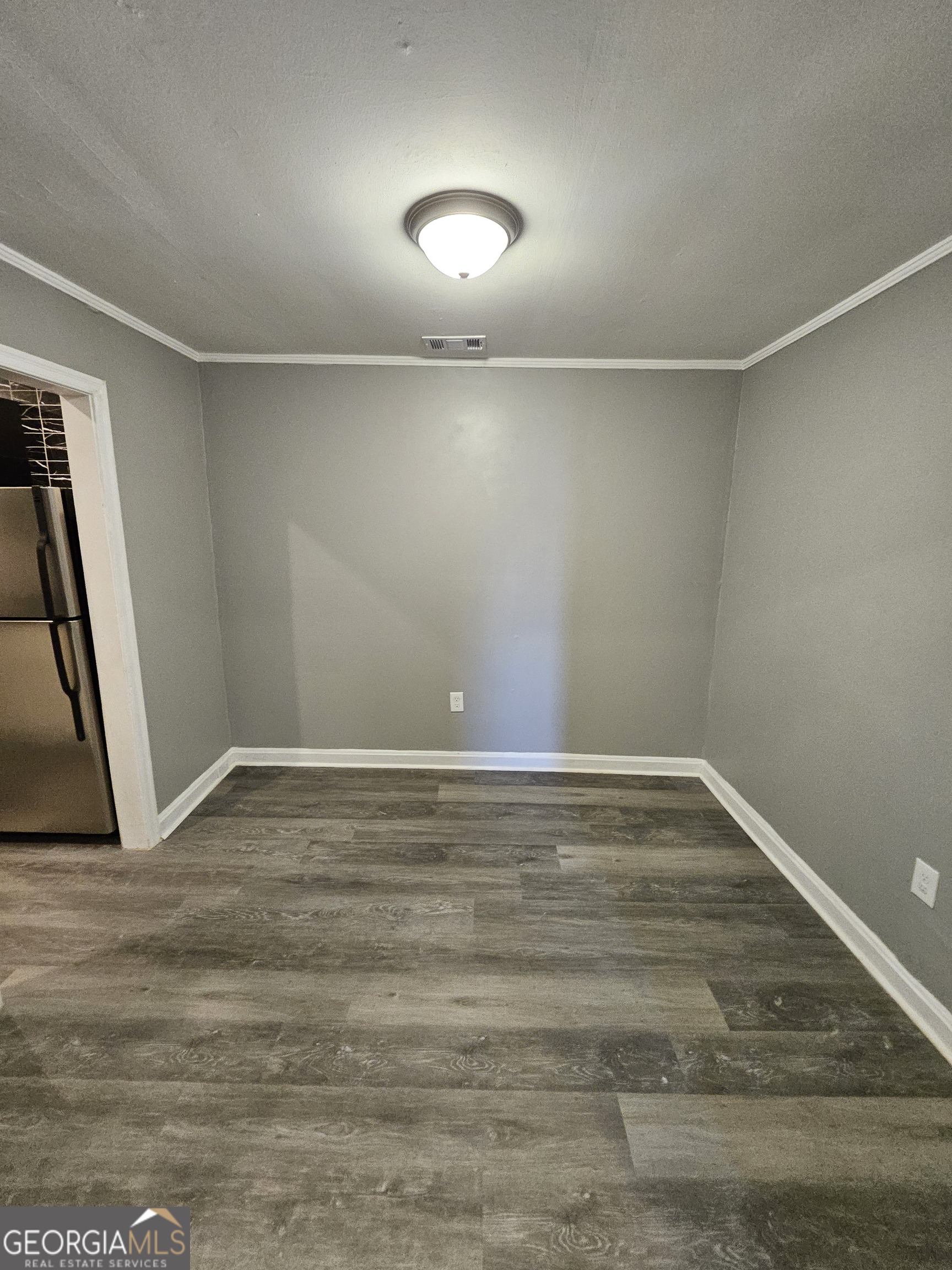 521 Meriwether Street, Unit A Griffin, GA 30224 - Photo 6 of 12 a view of an empty room