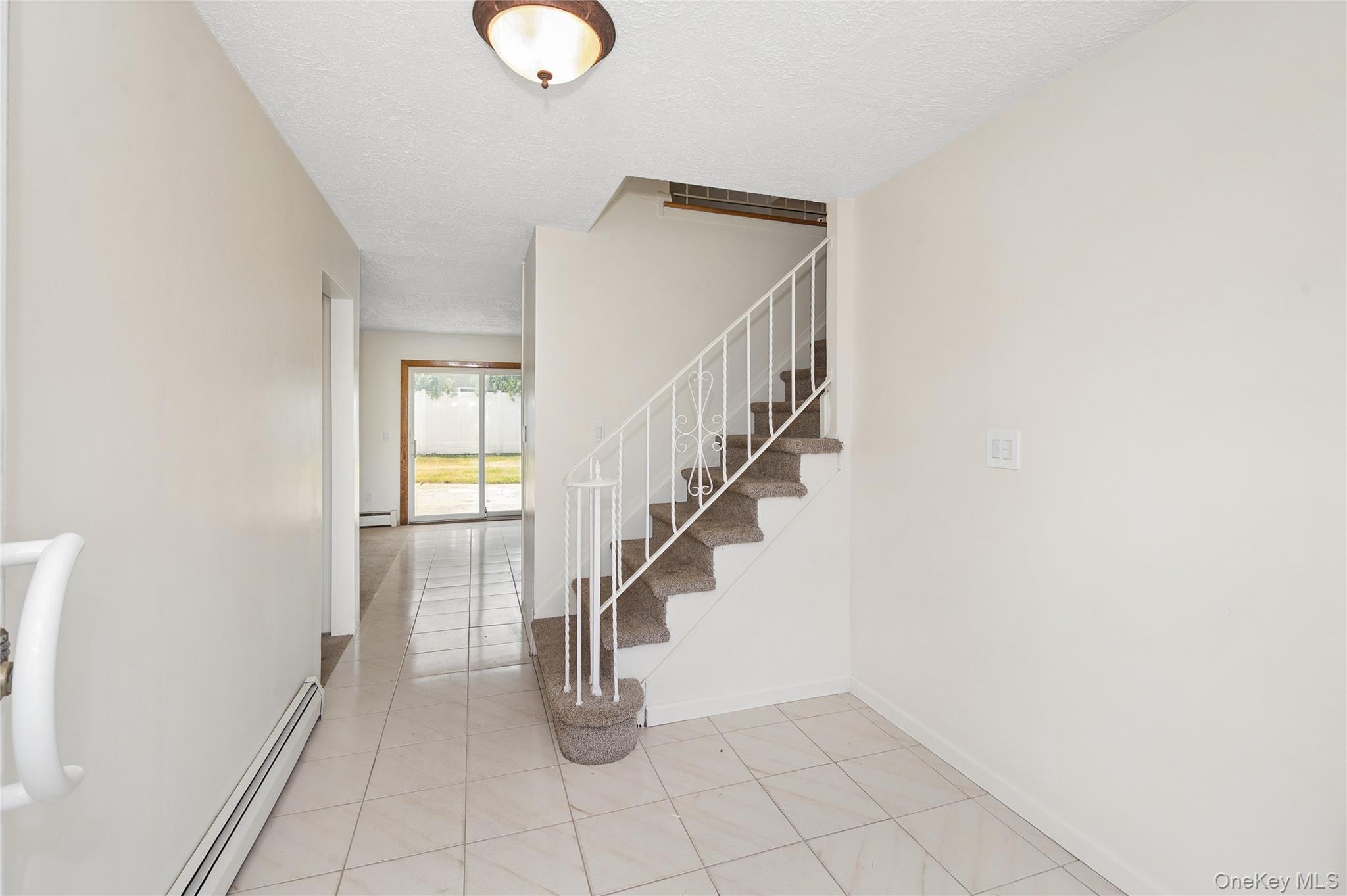 2625 Riverside Drive Wantagh, NY 11793 - Photo 4 of 20 a view of entryway and hall with a window