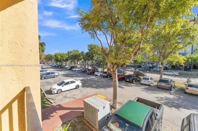 a balcony with chairs and a book on a table
